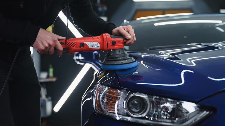 Machine polishing a car