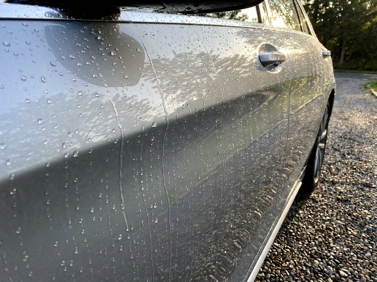 Water sheeting off coated paint