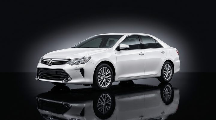 White Toyota Camry sedan in studio